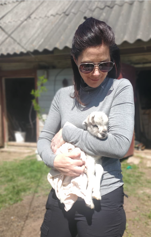 Erin Burnett and a newborn goat