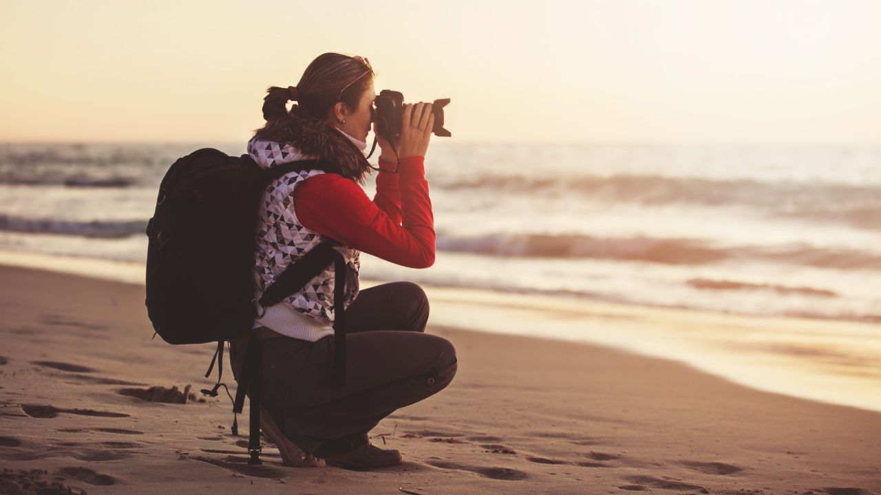 Person using an DSLR camera.