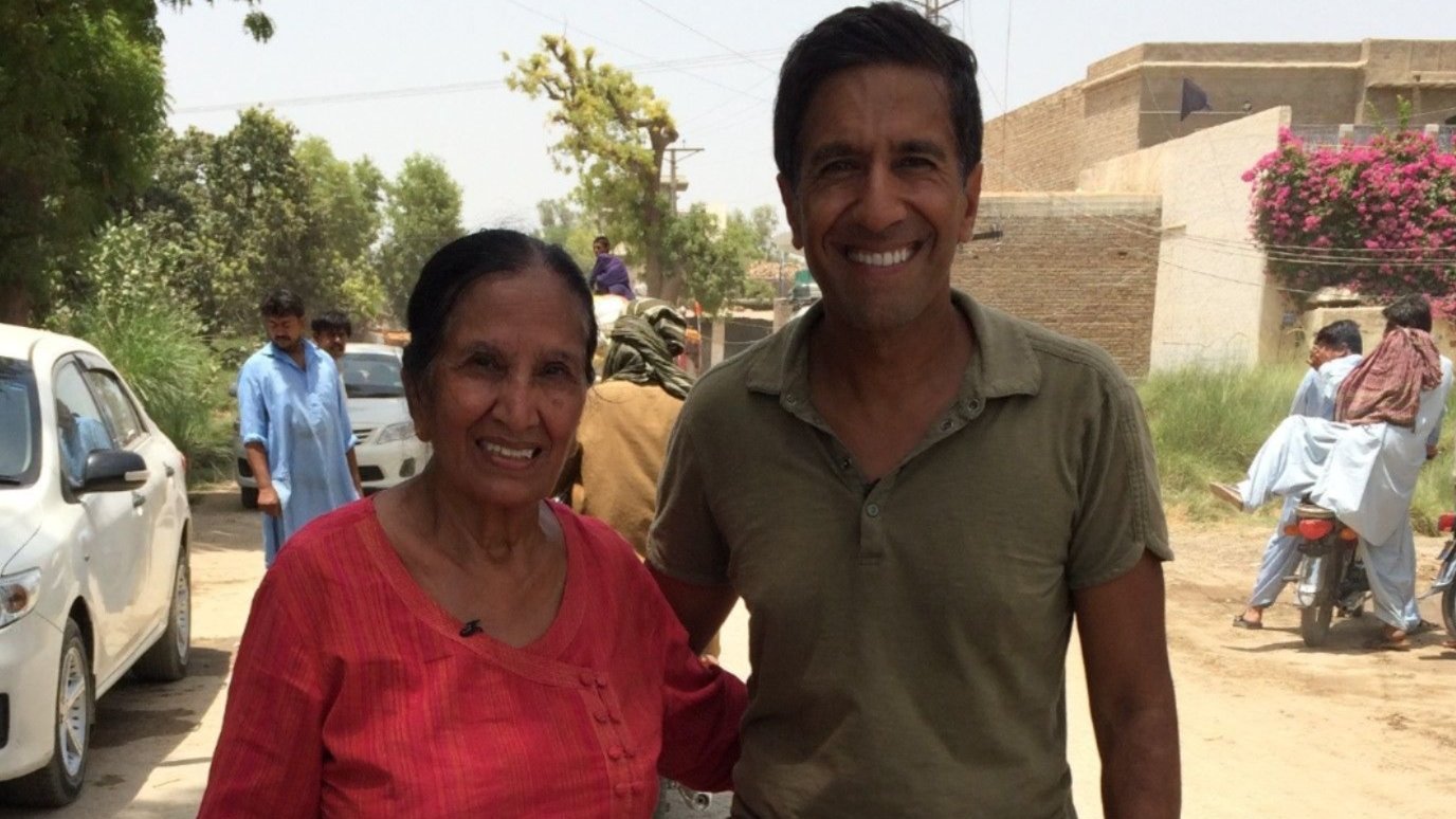 Dr. Sanjay Gupta and his mother, Damyanti Gupta, visit her hometown of Tharushah, Pakistan in 2014, as part of a project to trace their roots.