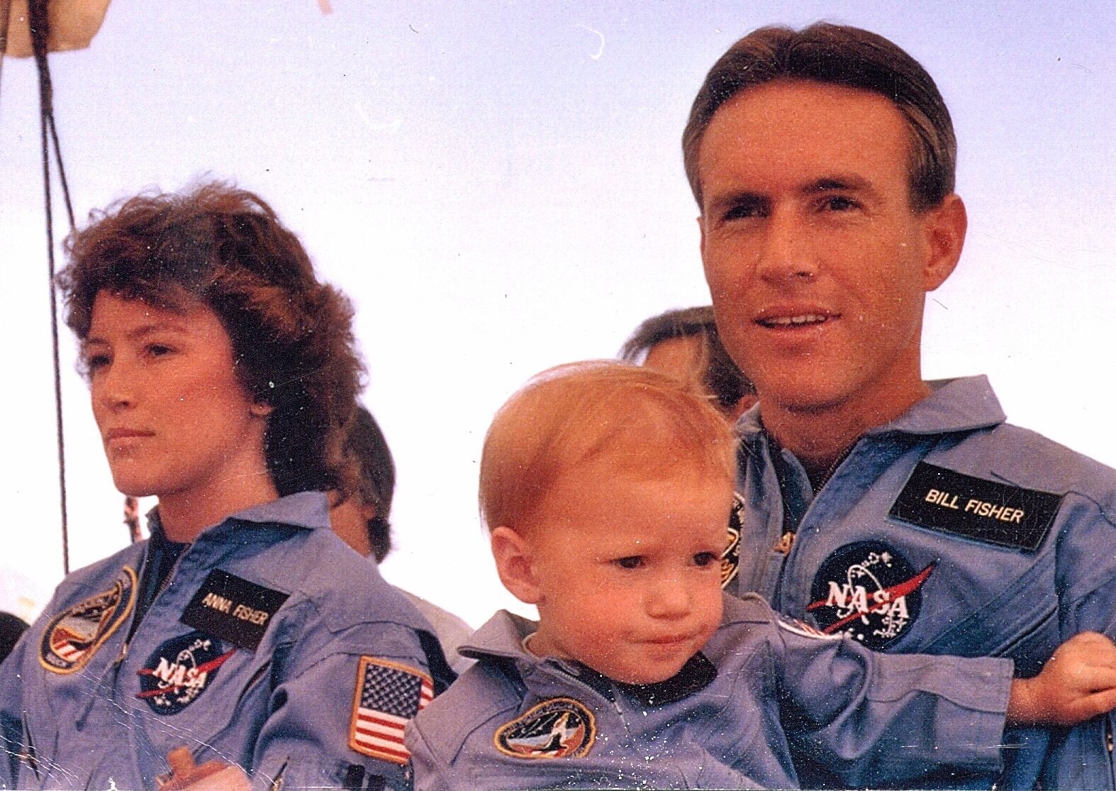 Fisher as a baby with her astronaut parents